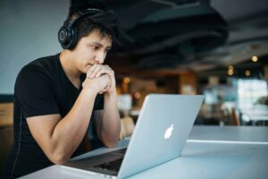 A professional in deep work mode, protected from distractions by AI time management tools.”